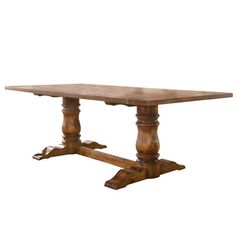 an old wooden table with two legs and a wood top, against a white background