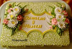 a cake decorated with flowers on top of a white plate