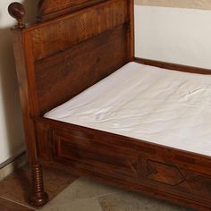 the bed is made and ready to be used as a headboard or foot board