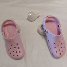 Lightweight And Water-Friendly, These Super-Comfortable Clogs Are Constructed From Signature Croslite And Can Be Customised With Jibbitz Charms. Ft. A Round Toe . Never Used Size 8m- 10w Spring Non-slip Round Toe Mules, Spring Non-slip Flat Heel Clogs, Comfortable Pink Slip-on Clogs, Casual Pink Beach Clogs, Pink Summer Clogs With Cushioned Footbed, Summer Pink Clogs With Cushioned Footbed, Pink Flat Clogs For Beach, Purple Slip-on Clogs For Summer, Casual Pink Slip-on Clogs