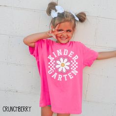 This Back to School Kindergarten Shirt is the perfect First Day of School Tee for a Girl or a Boy! Our Comfort Colors tees are garment-dyed for that trendy distressed look. ♥ 》 》HOW TO ORDER 《 《 * Select product, size + color from the drop down menus * Add to cart + place order ♥ * Your shirt is now in production & will be ready to ship in 1-3 days! 》 》SIZING 《 《 These tees are unisex. The Comfort Colors tees are a boxy cut, and run true to size. 》 》PRODUCTION + SHIPPING《 《 * Order Production: 1 Back To School Kindergarten Outfits, Playful Pink T-shirt For School, Playful Pink Shirt With Letter Print, Playful T-shirt For School In Spring, Short Sleeve Shirt For Spring With School Spirit, Fun Pink T-shirt For End Of School Year, Short Sleeve Shirt With School Spirit For Spring, Short Sleeve School Spirit Shirt For Spring, Spring Letter Print T-shirt