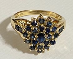 GORGEOUS Vintage 14K Yellow Gold .87 CTW Sapphire Cluster Ring Stunning estate ring with amazing hue blue sapphires! Ring has a .15 ct pear cut Sapphire center stone surrounded by 24 round .03 ct sapphires. .87 CTW! Size 6 Weighs 3.6 grams Please message me with any questions Shipped insured/delivery confirmation I guarantee item to be exactly as described and pictured Sapphire Cluster Ring, Black Opal Pendant, Locket Ring, Estate Ring, Fancy Rings, Bangles Jewelry Designs, Gold Fashion Necklace, Classy Jewelry, Heart Pendant Diamond