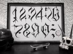 a black and white photo with some writing on the wall next to a pair of scissors