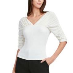 This Top By Bcbgmaxazria Blends Two Fabric Styles - A Delicately Gathered Yoke And Sweater-Like Bodice - To Form A Textural Design That Artfully Works. Complete The Look With Simple Tailoring, Like Pleated Trousers Or Skirts. V-Neck Elbow-Length Sleeves Pullover Style Rayon/Spandex Machine Wash Imported Ruched Formal Tops For Summer, Formal Ruched Tops For Summer, Summer Formal Ruched Tops, Elegant Stretch Blouse With Ruched Detail, Elegant Stretch Ruched Blouse, Elegant Ruched Stretch Blouse, Ruched Formal Top For Spring, Formal Ruched Top For Spring, Spring Formal Ruched Top