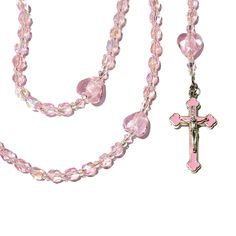 A small, handmade, 5 decade, Catholic rosary. Accented with Miyuki, silver-lined crystal AB seed beads and, pink, faceted, bicone glass beads.AVE (Hail Mary Beads): 6 mm, Czech, crystal pink shimmer AB, round, faceted glass beadsPATER (Our Father Beads): 12 x 14 mm, pink glass heartsCRUCIFIX: Orthodox/byzantine crucifix w/pink enamel, silver oxidized, approx. 1.6", Italian-made, one sided CENTERPIECE: small EucharistLENGTH: 16 1/4 inches Also known as Dominican Rosary and Holy Rosary. Pink Beaded Spiritual Rosary, Pink Spiritual Faceted Beads, Pink Beaded Spiritual Rosary Bracelet, Pink Beaded Rosary With Round Beads, Pink Beaded Rosary, Holy Rosary, Catholic Rosary, Our Father, Hail Mary