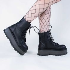 Combat boots with a twist! The SLACKER-55 boots are a versatile lace-up ankle boot with a comfortable 2-inch platform that are sure to become yer new fave staple. Vegan Black PU leather 2-inch platform Lace-up Inner zip Ankle length U.S women's sizing - refer to size chart for more info Gothic Lace-up Boots With Lug Sole, Gothic High-top Combat Boots With Lug Sole, Punk Ankle-high Platform Boots With Reinforced Heel, Edgy Round Toe Boots With Thick Bottom, Edgy Boots With Thick Bottom And Round Toe, High-top Platform Lace-up Boots, Punk High-top Platform Boots With Reinforced Heel, High-top Punk Platform Boots With Reinforced Heel, Platform High-top Heeled Boots For Streetwear