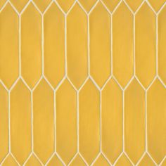 a yellow tiled wall with white lines on it