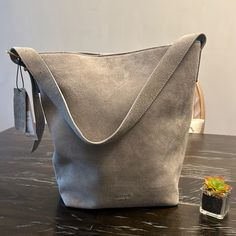 New Margot Kate Bucket Bag Light Grey Suede Size: 14x14x6 New Inventory: Shelf.1 Bag Light, Gray Suede, Tote Purse, Womens Tote Bags, Bucket Bag, Light Grey, Tote Bag, Grey, Women Shopping