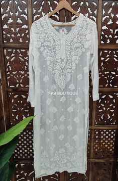 Description Material : Viscose  Wash Care : Hand Washable Kurti Length : 46-47 inches Occasion : Casual Wear Touch and Feel - Comfortable and Soothing Sleeve-3/4 Sleeves Package Contains : 1x Kurti White Blouse With Chikankari Embroidery For Summer, White Bohemian Self Design Kurta, White Long Sleeve Blouse With Chikankari Embroidery, Long Kurta With Floral Embroidery For Diwali, Diwali Long Kurta With Floral Embroidery, White Embroidered Fabric With Self Design, Traditional White Embroidered Summer Fabric, White Bohemian Embroidered Fabric For Eid, Summer Wedding Traditional Wear With Chikankari Embroidery