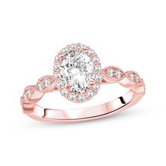 a rose gold engagement ring with an oval diamond center