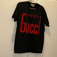 New Gucci 1921 T-Shirt With Rhinestones Sold Out Everywhere Red Gucci Cotton Top, Casual Red Gucci Tops, Gucci Designer Black T-shirt, Gucci Black Short Sleeve Tops, Gucci Black T-shirt With Logo Print, Luxury Gucci Tops With Logo Print, Gucci Black Crew Neck Top, Designer Gucci Tops With Letter Print, Designer Red Top With Graphic Print