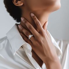 a woman wearing a diamond ring on her neck