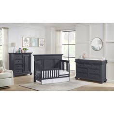 a baby crib and dresser in a room