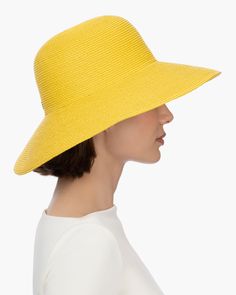 A versatile women's skimmer of our patented Squishee® packable straw. Eric's desire to create a simple, timeless sun hat that would transcend ever-changing trends resulted in this design. The Hampton is available in a range of numerous neutrals as well as a selection of delicious colors. This iconic women's Hampton rollable hat for sale online looks good on everyone and offers advanced sun protection, durability and packability. You will want to take it with you wherever you go this summer! The