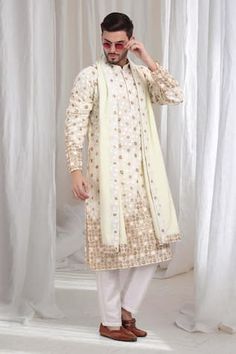 Ivory lime cotton kurta with floral motif embroidery. Paired with a matching dupatta with embroidered border and a solid pant. - Aza Fashions Spring Embroidered Chanderi Sherwani, Embroidered Off White Cotton Sherwani, Embroidered Off-white Cotton Sherwani, Spring Sherwani With Intricate Embroidery And Traditional Drape, Spring Wedding Cotton Sherwani, Traditional Wear With Chikankari Embroidery For Spring, Cream Chikankari Embroidered Sherwani In Chanderi, Festive Cotton Sherwani With Floral Embroidery, Wedding Cotton Sherwani With Floral Embroidery