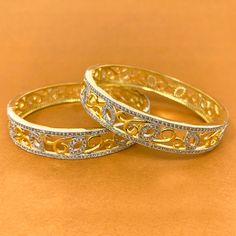 Unique and Stunning, White American Diamond stone bangles. These bangles are in gold-tone and will match a variety of outfits. You can wear them with formal traditional outfits, western outfits, or even informal casual gatherings. Best for gifting or for personal use, wear it to any occasion and be the spotlight. Eye-catching and unique jewelry that will set you apart. Gift this piece to a loved one, and see their face light up with joy. Elegant Openable Bangle For Festive Occasions, Elegant Openable Bangle For Festivals, Elegant Festive Openable Bangle, Festive Elegant Openable Bangle, Elegant Gold Plated Bangle For Festivals, Elegant Gold Plated Openable Bracelets, Elegant Bangle Bracelets For Festivals, Elegant Gold-plated Openable Bracelets, Festive Elegant Gold-plated Bangle