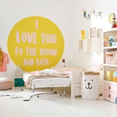 a child's bedroom decorated in white and yellow with an i love you to the moon wall decal