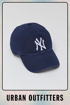 a baseball cap with the new york yankees logo on it and an urban outfitters tag