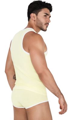 White Color Block Sleeveless Tank Top, White Sleeveless Color Block Tank Top, Sporty Sleeveless Tank Top With Contrast Trim, Yellow Color Block Sleeveless Top, Color Block Stretch Sleeveless Top, Stretch Sleeveless Top With Contrast Color, Sleeveless Stretch Top With Contrast Color, Casual Sleeveless Top With Contrast Color, Casual White Color Block Tank Top