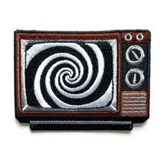 a black and white patch with an image of a tv on it's side