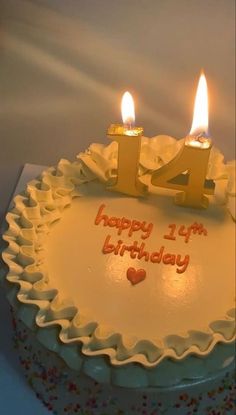 a birthday cake with two candles on it