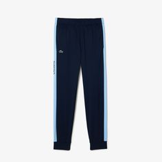 Enjoy maximum freedom of movement in these track pants, with iconic colored stripes. Made from a hard-wearing fabric to withstand intensive training sessions. Bonus ? The Lacoste print on the side is sure to get you noticed. Lacoste Men, Heritage Brands, Track Pants, Polyester Fabric, Tennis, Sweatpants, Track, Stripes, Trousers