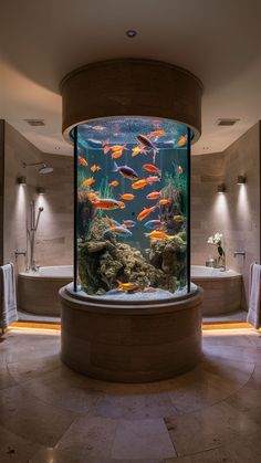 a large fish tank in the middle of a bathroom