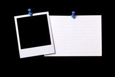 two polaroid frames are next to each other on a notepad with blue thumbnails