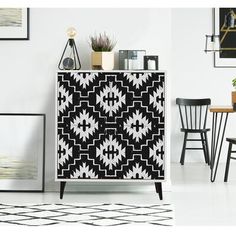 a black and white patterned cabinet in a room