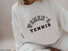 -Women's Tennis Crewneck Sweatshirt. Great gift for any sports fanatic.  -Crewneck sweatshirt, unisex sizing (refer to size chart).  -Comfortable, true to size sweatshirt. If you prefer a more fitted option, we recommend you size down.  -Comes in 3 neutral color options: white, sand, ash (as shown in photos). SHIRT DETAILS: -Ideal for any situation, a unisex heavy blend crewneck sweatshirt is pure comfort. These garments are made from polyester and cotton. This combination helps designs come out Crew Neck T-shirt With Team Spirit, Relaxed Fit Lettering Sweatshirt For Sports, Relaxed Fit Sweatshirt With Lettering For Sports Events, Sporty Oversized Sweatshirt For Sports Events, Relaxed Fit Sportswear Sweatshirt For Sports Events, Sporty Sweatshirt With Screen Print For Sports, Relaxed Fit Team Name Sweatshirt For Sports, Sports Team Sweatshirt With Relaxed Fit, Relaxed Fit Sweatshirt With Team Name For Sports