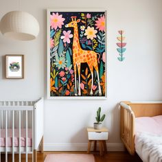 a baby's room with a giraffe painting on the wall and a crib