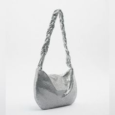 Shoulder Bag With Shiny Metallic Mesh Exterior. Lined Interior. Braided Shoulder Strap. Zip Closure. Height X Length X Width: 7.9 X 10.4 X 1.2 Inches (20 26.5 X 3 Cm) Chic Silver Zara Shoulder Bag, Zara Silver Shoulder Bag For Evening, Silver Zara Shoulder Bag For Evening, Zara Silver Evening Shoulder Bag, Chic Silver Bag For Summer, Chic Silver Bags For Summer, Glamorous Summer Clutch Bag, Zara Evening Shoulder Bag, Chic Zara Shoulder Bag For Party