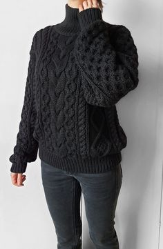 Gorgeous cable knit oversize sweater. 100% handmade ❤ Perfect quality.  The composition is 50% alpaca, 50% merino wool  Color: black  Collar: stand  Measurements of the sweater on the photo: - sweater width - 55 cm / 21.6 in - sweater length - 63 cm / 24.8 in - sleeve length (from neck to wrist) 70 cm / 27.5 in - collar length 11 cm / 4.3 in  I can make a custom SIZE according to your measurements. If you need change sweater width, sweater length, sleeve length or collar length please let me know.  If you would like another COLOR for your sweater please let me know.  Your sweater will be 100% handmade. Please, allow me 2 weeks to knit and ship out.  Free worldwide shipping If you have any quetions, please, send me message 😊   Dear knitters! Please do not use my photo to advertise your wor Black Chunky Knit Sweater For Fall, Oversized Black Knitted Sweater, Hand Knitted Black Sweater For Winter, Cozy Slouchy Cable Knit Sweater, Oversized Wool Chunky Knit Sweater, Oversized Chunky Knit Wool Sweater, Cozy Knitted Black Sweater, Oversized Hand Knitted Black Sweater, Black Alpaca Sweater For Fall