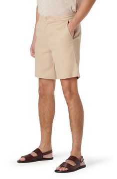 Made from a breathable linen blend, these drawstring chino shorts feature a comfortable elastic waist and pair well with all your favorite looks. 8" inseam; 21" leg opening; 11 1/2" front rise; 16" back rise (size Medium) Zip fly with button closure Elastic waist with internal drawcord Front slant pockets; back welt pockets 54% linen, 44% cotton, 2% spandex Dry clean or machine wash, line dry Imported Cotton Bermuda Shorts For Vacation, Cotton Bermuda Bottoms For Beach Season, Casual Bermuda Shorts For Beach With Short Inseam, Vacation Bermuda Shorts With Relaxed Fit, Cotton Shorts For Warm Weather, Casual Cotton Bermuda Shorts For Vacation, Solid Cotton Bermuda Shorts For Beach, Solid Color Cotton Bermuda Shorts For Beach, Relaxed Fit Cotton Shorts For Warm Weather