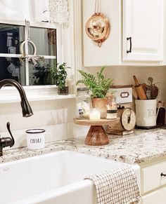 a kitchen counter with pots and pans on top of it next to a sink