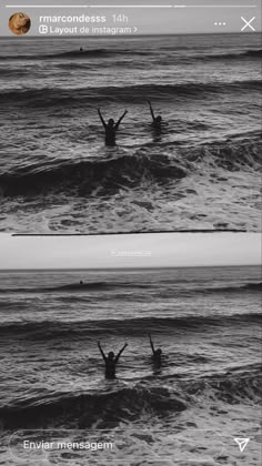 two people in the ocean with their arms up and one person standing in the water