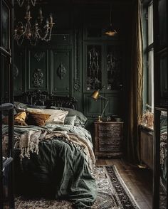 a bedroom with dark green walls and an antique rug on the floor in front of the bed