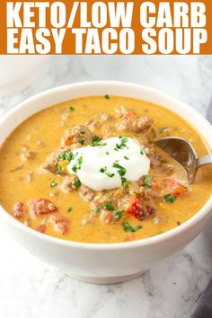 a close up of a bowl of soup with a spoon in it and the words keto / low carb easy taco soup