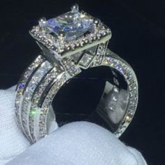 an engagement ring with two rows of diamonds on it