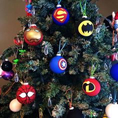 a christmas tree decorated with superhero ornaments