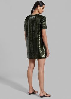 Color: Olive Embroidered sequin fabric Relaxed fit Mini length Round neckline Concealed zipper on sleeve Short sleeves Lined 100% Polyester Lining: 57% Viscose 43% Polyester Dry Clean Only By The Frankie Shop. Imported *All finishings on neckline and hem done by hand