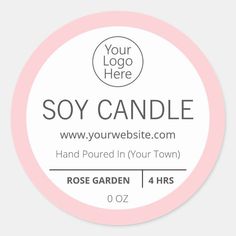 a round sticker with the words soy candle in grey and pink, on a white background