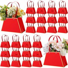 a bunch of red bags with flowers in them