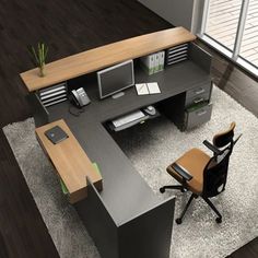 an office desk and chair in the middle of a room