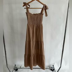 100% Cotton. Sleeveless, Square, A-Line Silhouette, Midi, Solid, Tan, Boho, Calf Length. Never Worn, Nwt. Excellent Condition. Sundress Maxi Dress With Tie Straps For Daywear, Sleeveless Beige Midi Dress With Tie Straps, Beige Sleeveless Midi Dress With Tie Straps, Sleeveless Beige Midi Dress For Day Out, Beige Sleeveless Midi Dress For Day Out, Beige Maxi Dress With Adjustable Straps For Day Out, Beige Dress With Tie Straps For Daywear, Beige Tie-back Midi Dress For Beach, Sleeveless Beige Maxi Dress With Tie Back