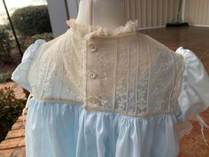 Very dainty, full lace yoke with coordinating fancy band around the hemline. Dress is shown in Swiss Batiste, but can be made in batiste as well. Can be made in many colors, blue, pink, light green, turquoise, white, ivory, yellow and more. Include your color preference as well as lace color preference or white or ivory. Heirloom Dresses, Heirloom Sewing, Lace Bodice, Antique Lace, Dress Purchase, Baby Fashion, Hair Bows, Baby Clothes, Victorian Dress