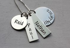 "Gorgeous sterling silver 4 charm necklace personalized however you would like them! Perfect for wearing every day and layering with other pieces. All components are solid sterling silver - chain, clasp, jump rings, and bars/discs. Large disc measures 3/4\" (19 mm), 9/16\" disc (15 mm), and two rectangles about 1\"x 5/16\" (25 mm X 8 mm). Pick your favorite chain on this one! Please let me know these details in the note to seller box when placing your order - *Name or words/numbers you would lik Silver Name Charm Necklace For Everyday, Sterling Silver Charm Necklaces With Name, Everyday Silver Name Necklace With Charms, Silver Sterling Silver Charm Necklaces, Customizable Sterling Silver Charm Necklaces, Customizable Sterling Silver Charm Necklaces In Silver, Names Necklace, Mommy Necklace, Family Necklace