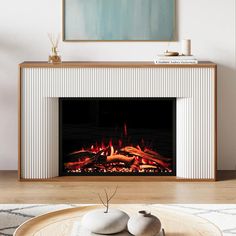 a living room with a fire place in the center and two rocks on the coffee table