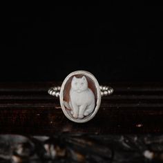 Chic and classy. Not only for cat lovers! This delicate, vintage inspired ring is an everyday wear piece.  A genuine (shell) cameo featuring a lovely cat is set in a simple .925 bezel and soldered on a beaded wire band. Made by hand in our jewellery studio in Greece. Each cameo is hand carved and each ring is made after purchase with respect to individuality and uniqueness. Please choose your favorite stone from the drop down menu during checkout. See last photo of the listing for details. -DETA Vintage Silver Cat Design Jewelry, Vintage Sterling Silver Cameo Ring, Cat Rings, Jewellery Studio, Vintage Inspired Rings, Lovely Cat, Sterling Silver Cat, Cameo Jewelry, Cat Ring