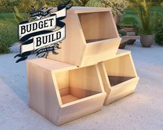 three wooden boxes stacked on top of each other with the words budget build above them